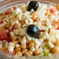 Chopped Salad · Romaine, turkey, garbanzo beans, tomatoes, and mozzarella finely chopped. Tossed with balsam...