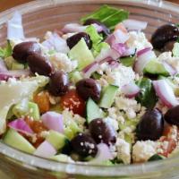 Greek Salad · Romaine, cucumber, tomatoes, onions, Kalamata olives, and feta cheese tossed with Greek dres...