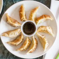 Pot Stickers · Ten pan fried dumplings filled with chicken and vegetables.