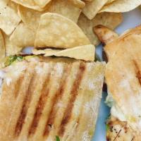 Chicken Pesto Panini · Grilled chicken breast, avocado, sun-dried tomatoes and provolone cheese choice of side sala...