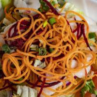 Yum Mamuang (Mango Salad) · Fresh mango with grilled prawns, onions, cilantro and toasted cashews on a bed of lettuce wi...