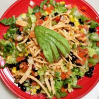 Southwest Salad · Romaine lettuce, black beans, tomatoes, tortilla strips, avocado, corn. Pico de gallo and gr...