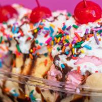 Banana Split · Your choice of three flavors of ice cream topped off with whip cream, chocolate syrup, cherr...