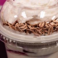 Strawberries & Cream · Freshly cut up strawberries with homemade cream topped with granola, coconut flakes, and whi...