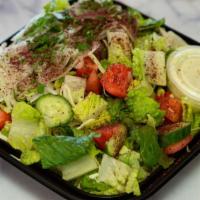 Fattoush Salad · A fresh mix of lettuce, cabbage, tomatoes, parsley, onions, cucumber and sumac. Served with ...