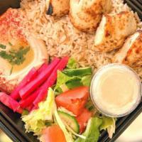 Chicken Breast Kebab Plate · Marinated cubes of chicken breast. Served with rice, salad, and hummus.