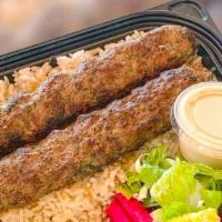 Beef Kefta Kebab Plate · Deliciously spiced ground beef kebab mixed with parsley and onions. Served with rice, salad,...