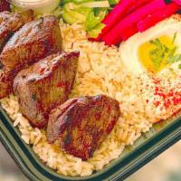 Beef Fillet Kebab Plate · Deliciously spiced cubes of tender beef kebab. Served with rice, salad, and hummus.
