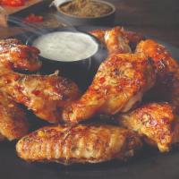 Roasted Wings - 10 Pieces · We've done it again. Starting with the tradional bone-in wings, oven roasted until crispy, k...