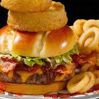 Western Bacon Burger · It's like a burger with spurs. BBQ Sauce, melted cheddar, bacon and onion rings all wrangled...