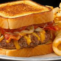 Twisted Texas Melt · Yippee Kai Yay, hungry trucker! Beef meets caramelized onions, bacon and cheddar cheese, ful...