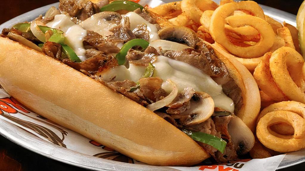 Philly Chicken Cheesesteak Sandwich · Yo, Adrian ... I made you a sandwich! Chicken topped with sautéed onions, green peppers, mushrooms and provolone cheese and served on a hoagie roll.