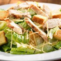 Chicken Caesar Salad · Fresh chopped romaine, Parmesan cheese and crispy seasoned croutons with a creamy Caesar dre...