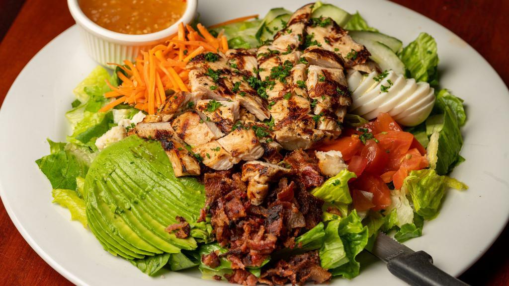 Cobb Salad · Served with Fresh Romaine Lettuce Diced Tomatoes Shredded Carrots Cucumbers Sliced Avocado A Boiled Egg Blue Cheese Crumbles And Bacon.