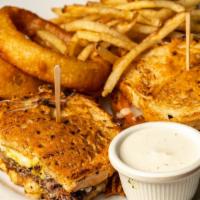 Sourdough Cheeseburger · Served on sourdough bread with grilled tomatoes mustered and parmesan cheese and Monterey ja...