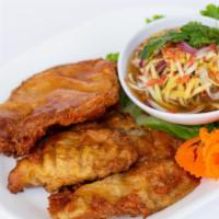 Fried Fish With Mango Salad · Sole fish filet lightly battered and fried. Served with a side of mango salad* (contains dri...