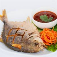 Fried Pompano Fish With Chili Sauce · Whole Pompano fish deep fried w/ a side of our special sweet chili sauce.