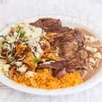 Chilaquiles Con Steak · Spicy. Chilaquiles, steak, served with rice, and beans.