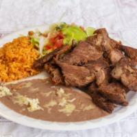 Carnitas · Crispy pork served with rice, beans, garnish salad, and tortillas.
