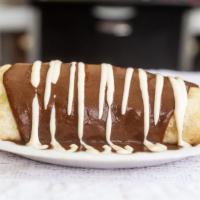 Mole Burrito · Stuffed with chicken, rice, beans, mole sauce and smothered in mole sauce with drizzled sour...