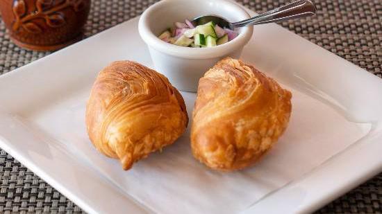 Curry Puff · Curry puff stuffed with ground chicken, carrot and potato served with cucumber sauce.