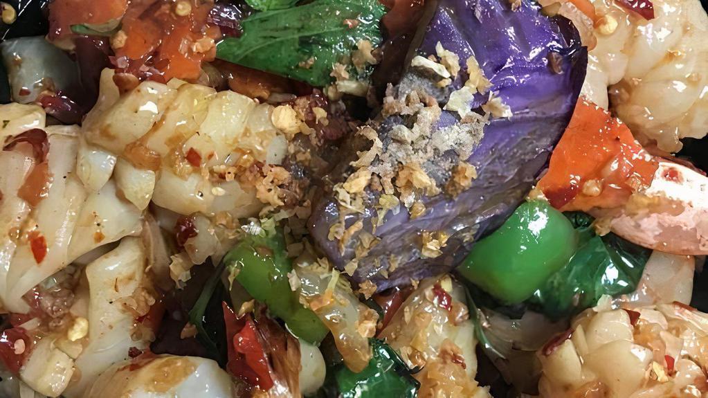 Pad Eggplant · Eggplant stir fry with onion, sweet basil, and Thai chili garlic paste. Served with jasmine rice.