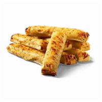 Cheesy Bread · Crispy, yet tender bread sticks brushed with garlic butter and sprinkled with cheese.