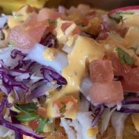 Ensenada Style Taco · beer battered shrimp or fish, cabbage, pico de gallo, dressing