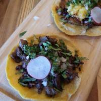 Asada Taco · premium beef, onions, cilantro