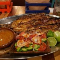 Zarandeado Fish Filet Xiri · charbrolied fish served with beans, sauteed vegetables & handmade tortillas