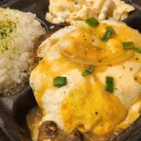 Loco Moco · Seared handmade beef patty atop steamed rice. Topped with brown gravy, sautéed mushrooms, an...