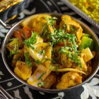 Chicken Kadai · Juicy chicken with bell peppers and onions.