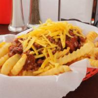 The Chili Cheese Fries · Hand cut fries loaded with hearty chili and warm creamy cheese.