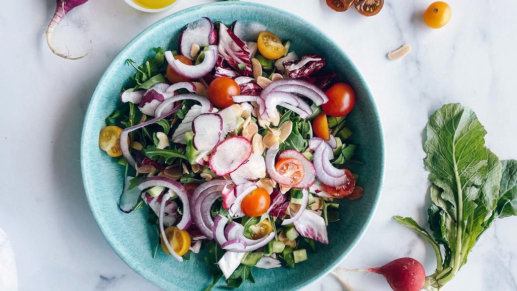 Vegan Salad · Arugula, sliced almonds, radicchio, cucumber, red onion, radish, cherry tomatoes, celery, lemon dressing.