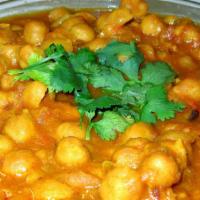Chana Masala · Chickpeas cooked with special herbs and spices in himalayan gravy sauce.