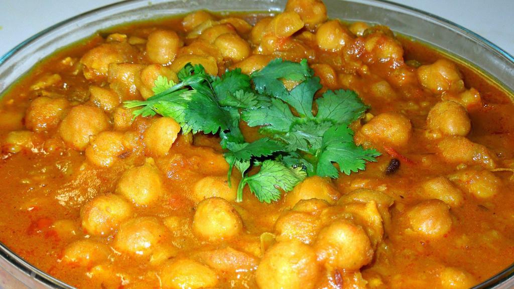 #15. Chana Masala · Chickpeas cooked with special herbs and spices in taste of himalayas gravy.