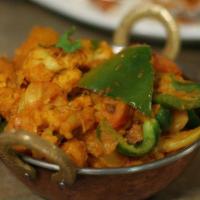 Aloo Gobi · Potatoes and cauliflower with onion and tomato sauce with himalayan spices.