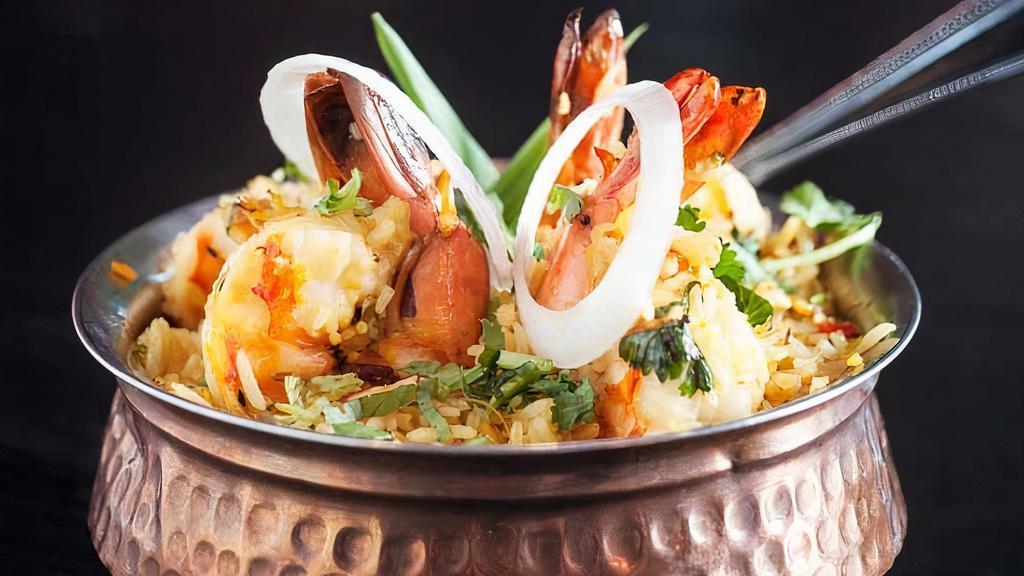 Shrimp Biryani · Shrimp cooked with cashew, raising and basmati rice with a mix of special herb and spices. Served with raita.