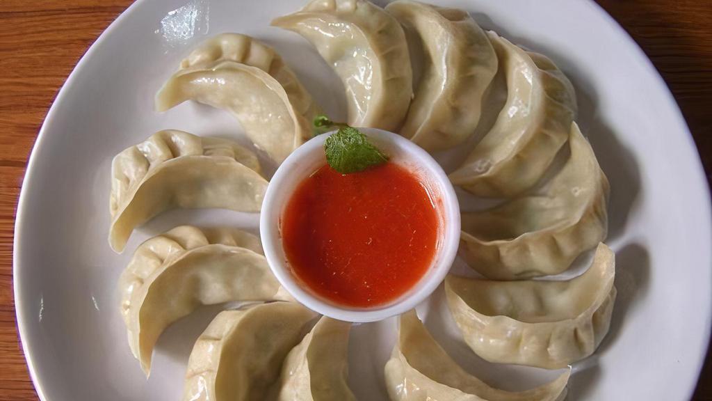 Vegetable Momo (8) · Steamed dumplings filled with minced cabbage, spinach, cashews, nuts, paneer, onion, cilantro, green onion and spices. Served with himalayan sauce.