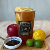 Honolulu · Passionfruit juice with a sweetened black tea and fresh lime, lemon and apple slices.