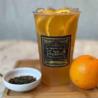 Tangerine Dream · A tangerine flavored green tea with fresh orange and sweetener.