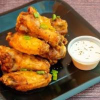 Lemon Pepper · 8 traditional wings tossed in lemon pepper (mild heat), served with a dipping sauce of your ...
