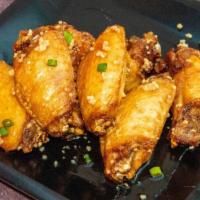 Honey Garlic · 8 traditional wings tossed in Honey Garlic served with a dipping sauce of your choice.
