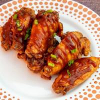 Classic Bbq · 8 traditional wings tossed in BBQ (mild heat), a dipping sauce of your choice.