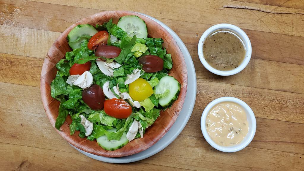 House Salad · Romaine lettuce, mushrooms, green onions,
cucumber, cherry tomatoes, with choice of
homemade dressing