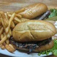 Garlic Steak Sandwich · Twin Filet Mignon*, four ounces each, marinated and served on garlic rolls, with a side. 
*c...