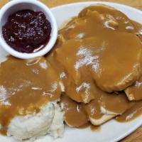 Hot Turkey · Fresh roasted turkey served open face with mashed potatoes, gravy, and cranberry.