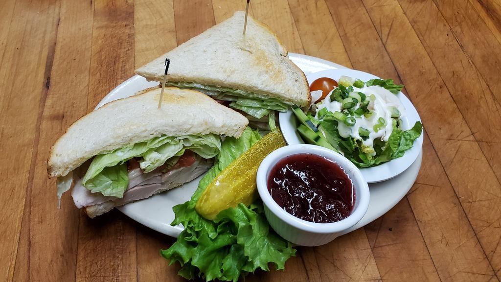 Cold Roasted Turkey Sandwich · Fresh roasted turkey, lettuce, tomato, cranberry serve on sourdough and with a side