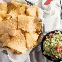 Fresh Guacamole And Chips · Ripe avocados hand-mashed with tomatoes, onions, garlic, fresh jalapenos and a splash of fre...