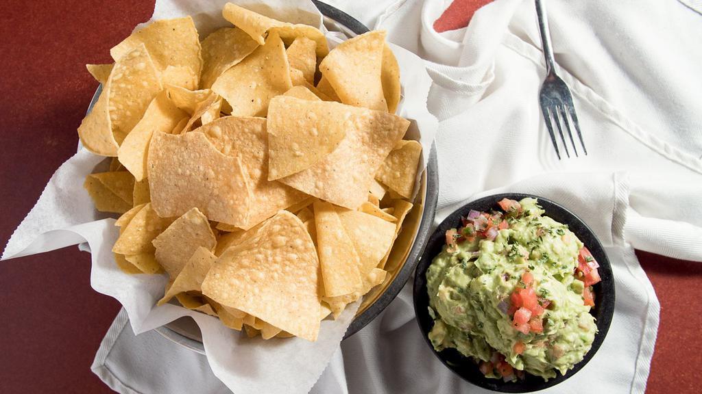 Fresh Guacamole And Chips · Ripe avocados hand-mashed with tomatoes, onions, garlic, fresh jalapenos and a splash of fresh-squeezed lime juice.  Includes a medium chip bag. (32 oz will receive large chip bag)